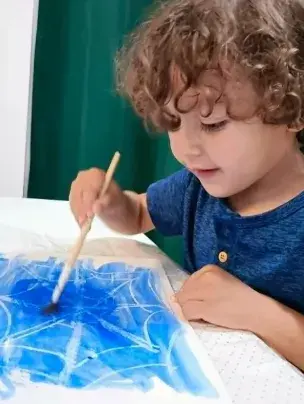 Student painting during tutoring at Teacher Jan's Place