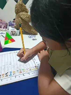 Student writing on a worksheet at Teacher Jan's Place