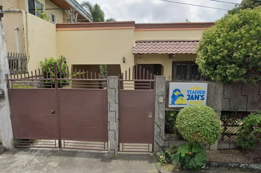 The gate and sign of Teacher Jan's Place on Broadway Street in Naga City