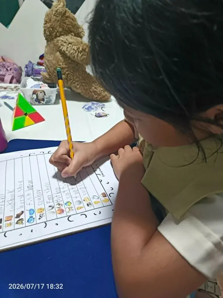 A student studying compound words on a worksheet