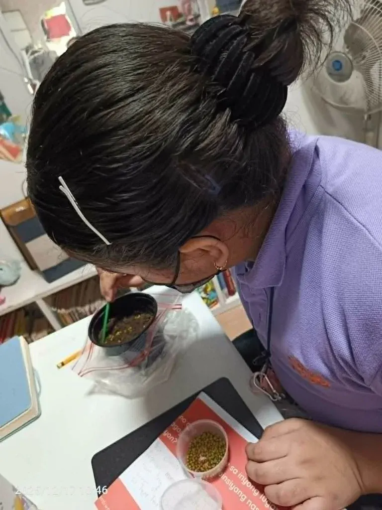 A student planting during a science activity